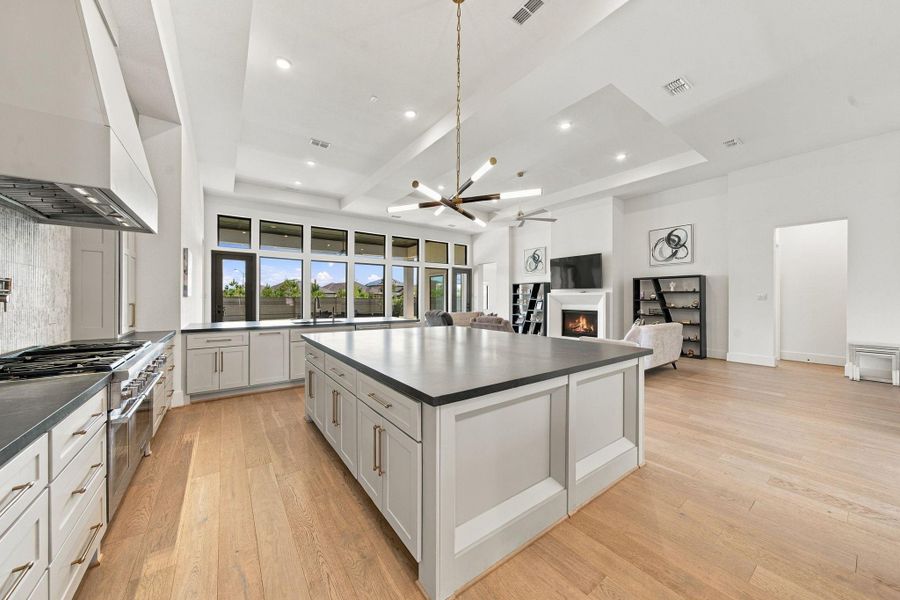 Picture yourself gathered around this oversized island while conversation flows effortlessly into the adjoining living space. This kitchen was made for connection!