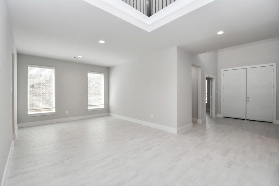 Make memories gathered around the table with your family and friends! This spacious dining room features elegant flooring, custom paint, and adjacent to family room and kitchen for open concept feel. Sample photo of completed home with similar floor plan. Actual colors and selections may vary.