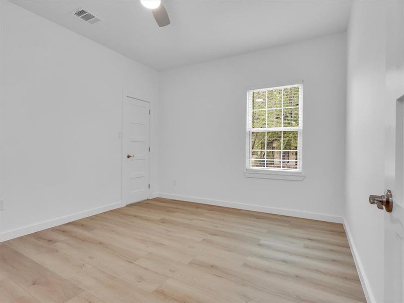 Spare room featuring light hardwood / wood-style floors and ceiling fan