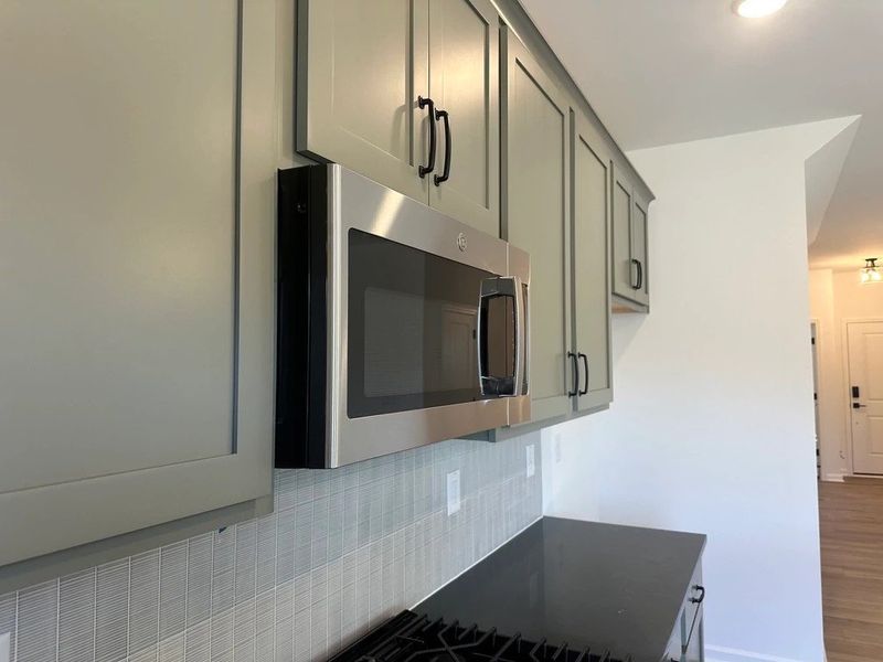 Kitchen featuring the AW Collection® Rosemary - Matte black, light wood, and garden-inspired style.