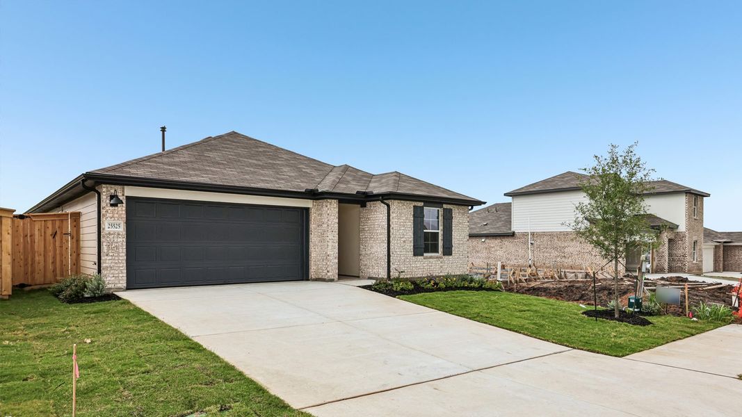 Front exterior of a new home in Briarwood, Elgin, TX, highlighting curb appeal (Image 19).