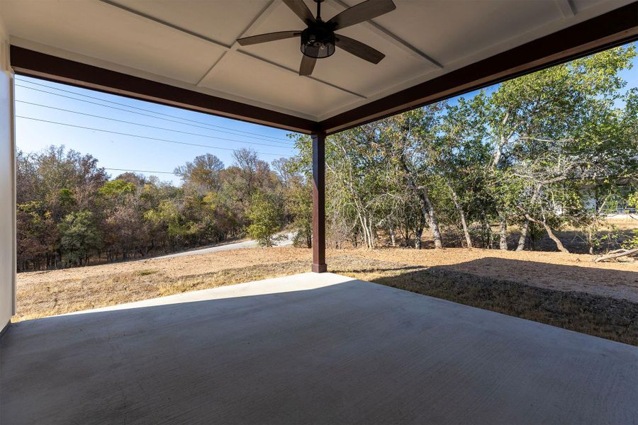 View of patio featuring ceiling fan