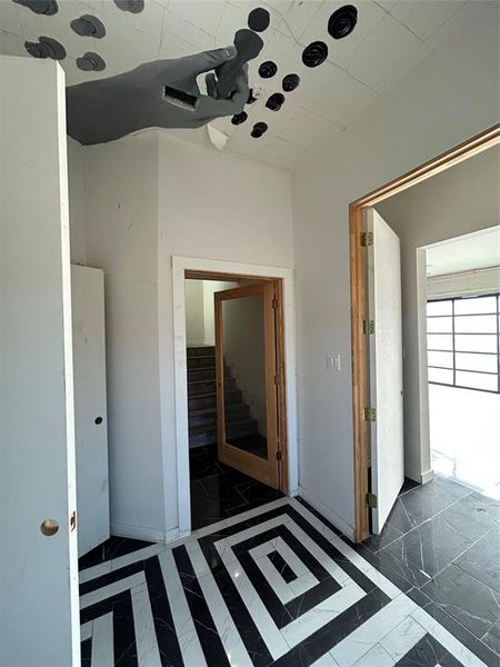 Unfurnished bedroom with inlaid floor details