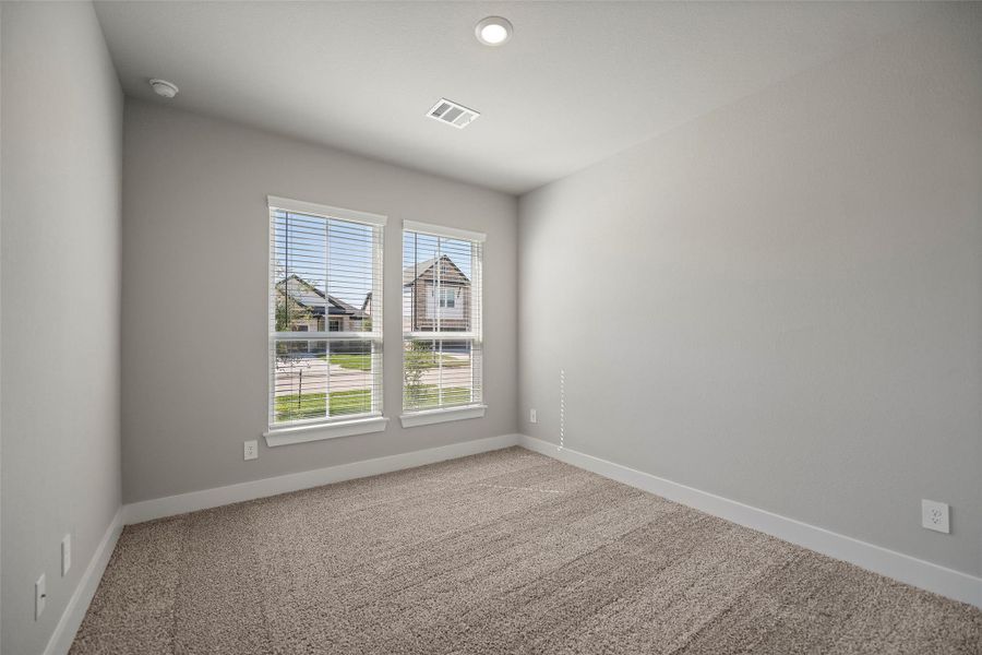 Spacious secondary bedrooms with plush carpet and ample closet space.