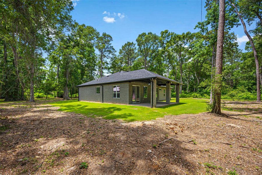 Exterior details and patio area of a home in , Splendora (Image 26).