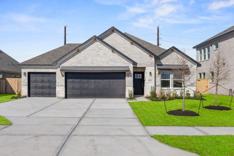 Front exterior of a new home in Ashland, Angleton, TX, highlighting curb appeal (Image 16).