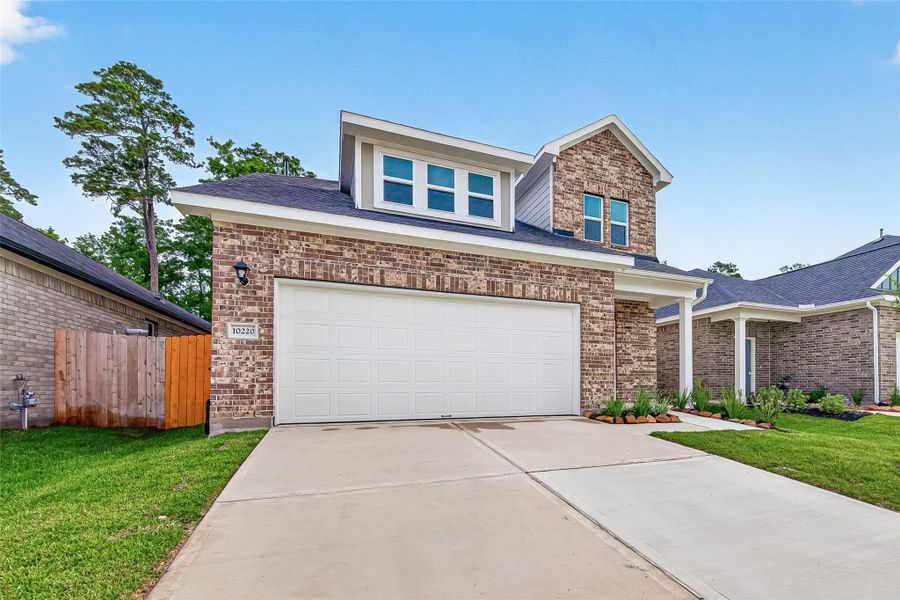 Front exterior of a new home in Mill Creek Trails, Magnolia, TX, highlighting curb appeal (Image 25).