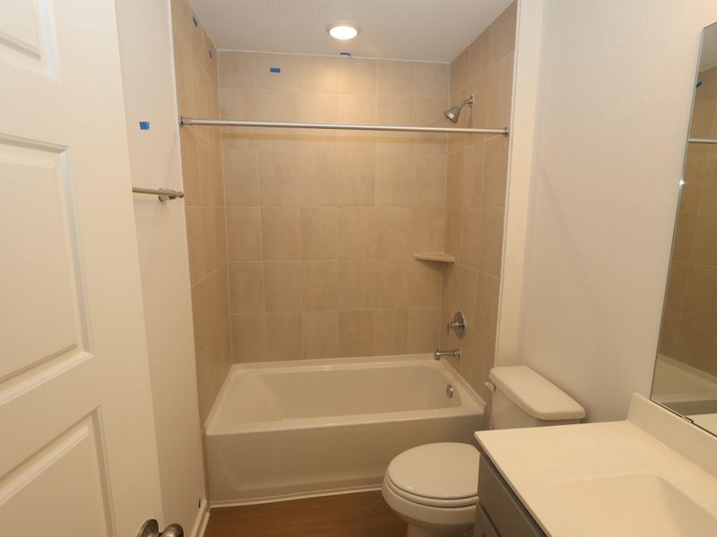 Furnished interior view inside a new home in Pinewood at Grand Texas, New Caney (Image 7).