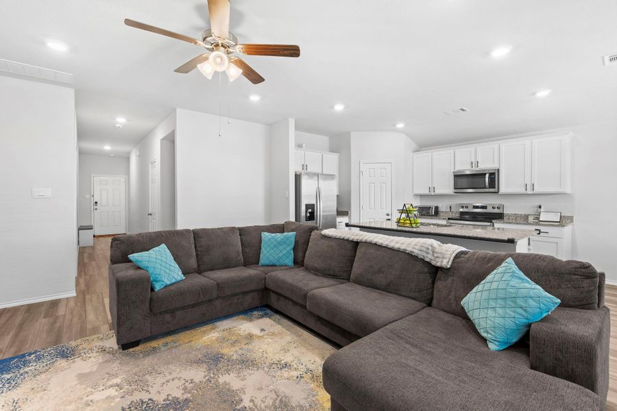 An open-concept living area flows into a well-appointed kitchen, ideal for entertaining and daily living. An open-concept living area flows into a well-appointed kitchen, ideal for entertaining and daily living.