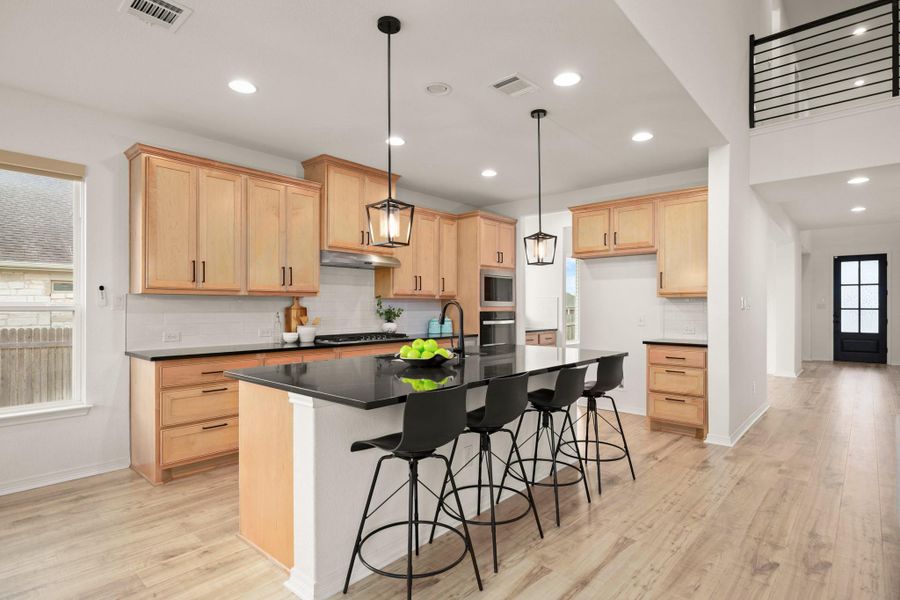 The kitchen is a contemporary dream with all the desirable modern finishes and a spacious sunny dining area. The kitchen is a contemporary dream with all the desirable modern finishes and a spacious sunny dining area.