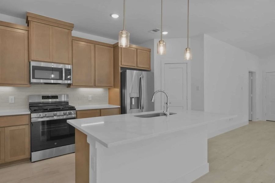 Representative furnished interior of a home built from the Chalet by Chesmar Homes in Meridiana Townhomes, Iowa Colony (Image 5).