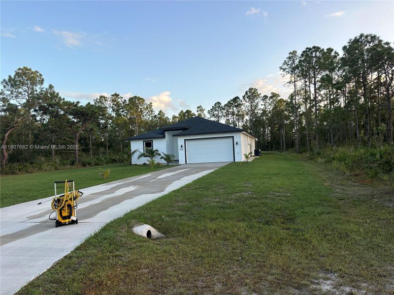 Front exterior of a new home in , Lake Wales, FL, highlighting curb appeal (Image 3).