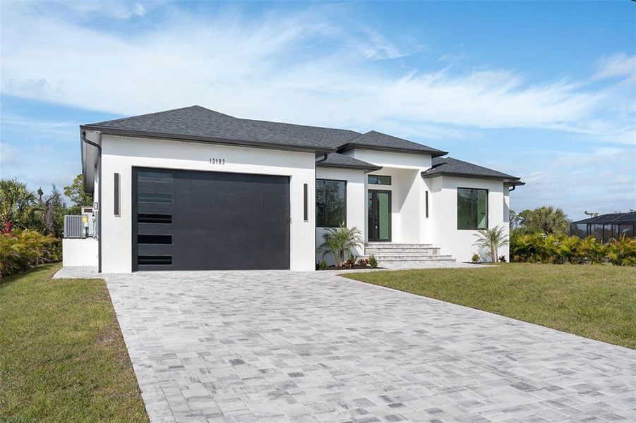 Front exterior of a new home in , Port Charlotte, FL, highlighting curb appeal (Image 2). Front exterior of a new home in , Port Charlotte, FL, highlighting curb appeal (Image 2).