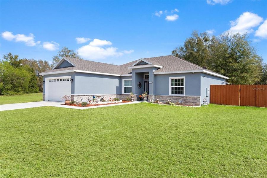 Front exterior of a new home in , Umatilla, FL, highlighting curb appeal (Image 25).