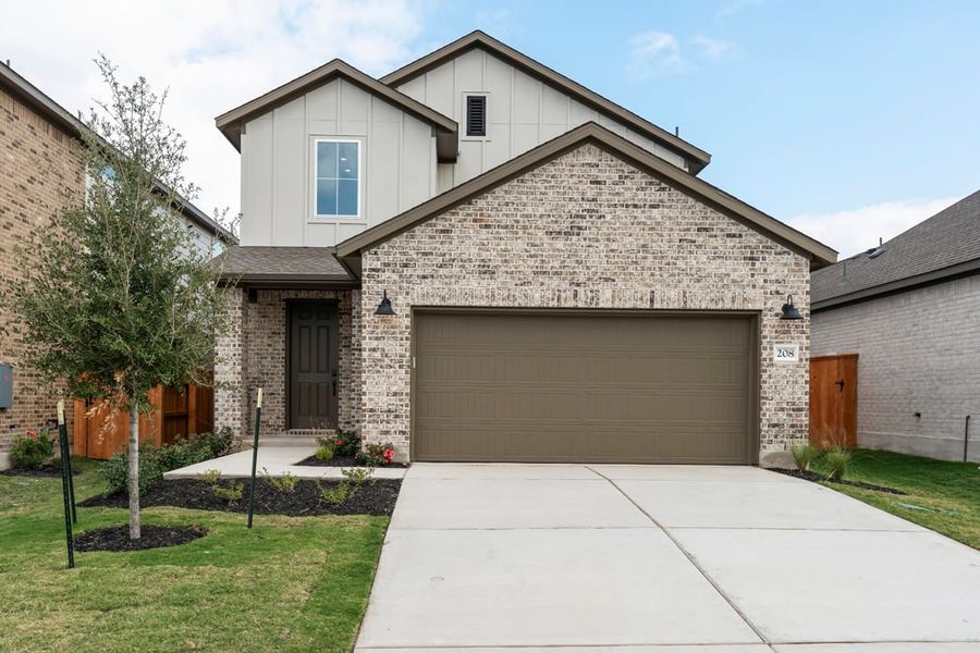 Front exterior of a new home in Terrace Collection at Lariat, Liberty Hill, TX, highlighting curb appeal (Image 2).