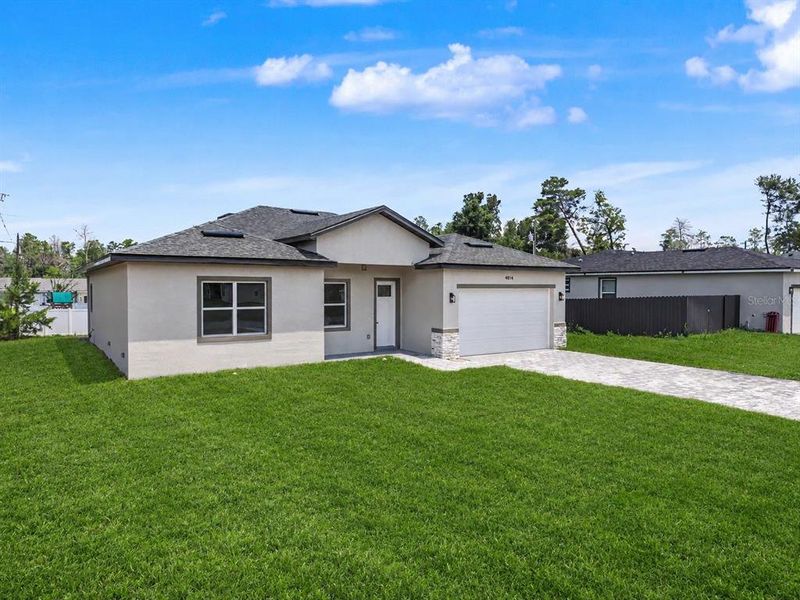 Front exterior of a new home in , Ocala, FL, highlighting curb appeal (Image 22).