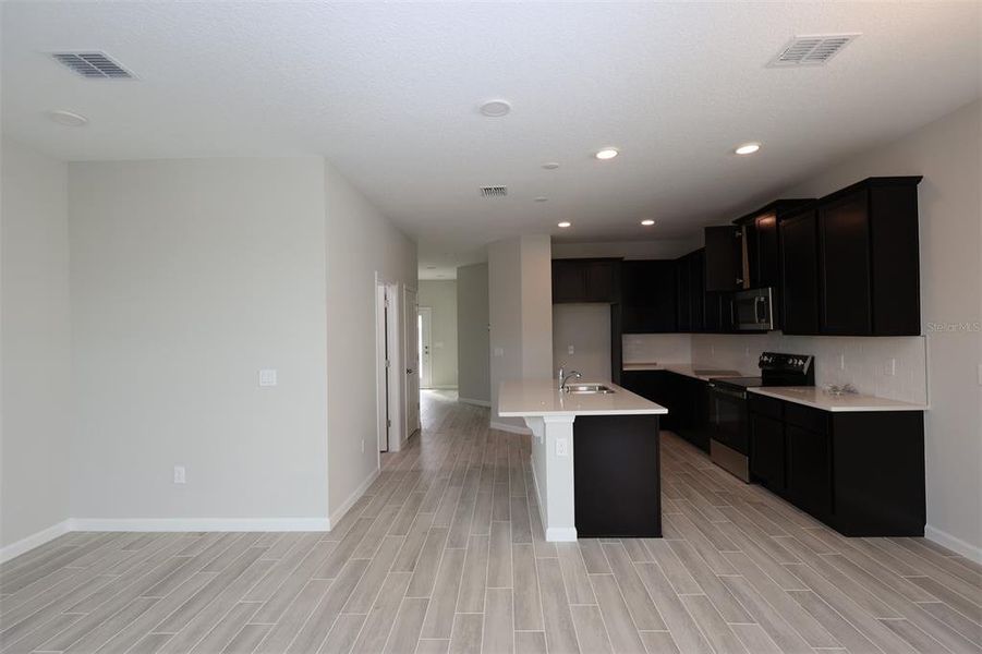 Furnished interior view inside a new home in Tribute at Ovation, Winter Garden (Image 12).