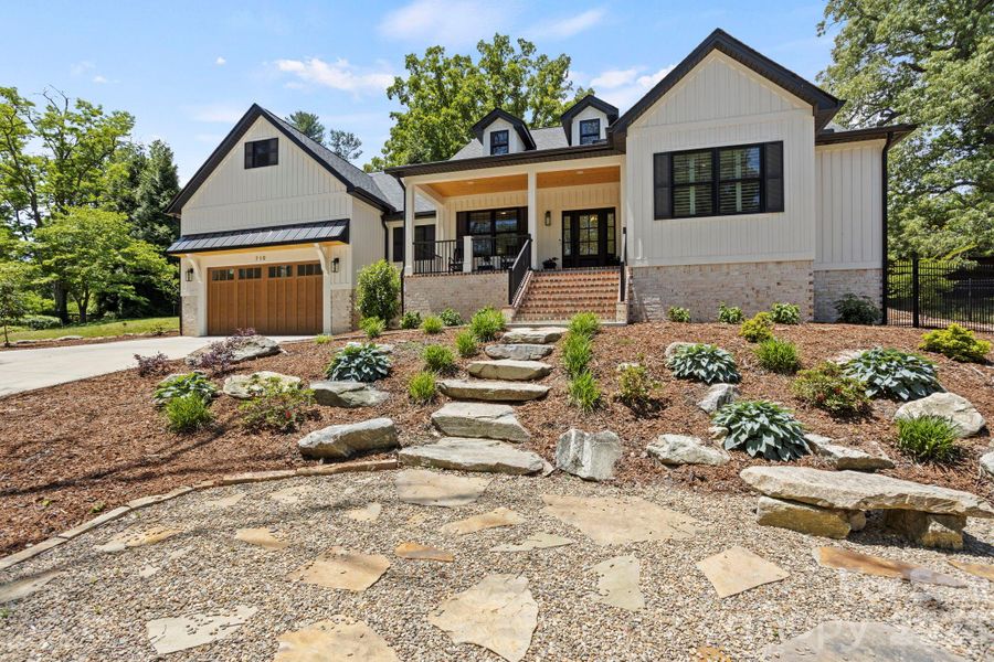 Front exterior of a new home in , Hendersonville, NC, highlighting curb appeal (Image 21).
