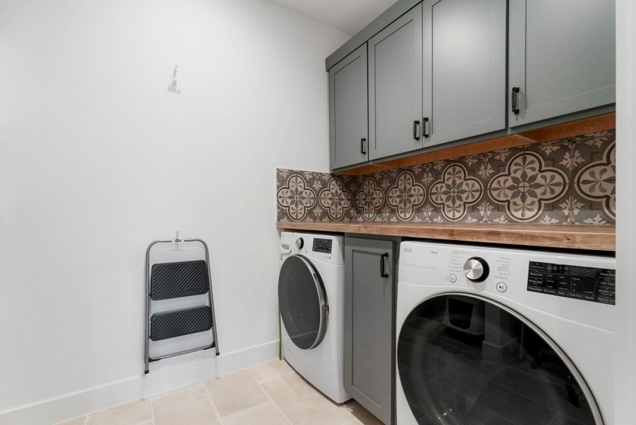 Laundry room is located in the center of the home with plenty of storage and counter space available. Not shown... open shelving and space for additional refrigerator or additional study area. Laundry room is located in the center of the home with plenty of storage and counter space available. Not shown... open shelving and space for additional refrigerator or additional study area.