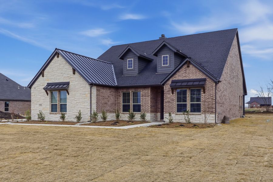 Front exterior of a new home in Fannin Ranch, Leonard, TX, highlighting curb appeal (Image 22).