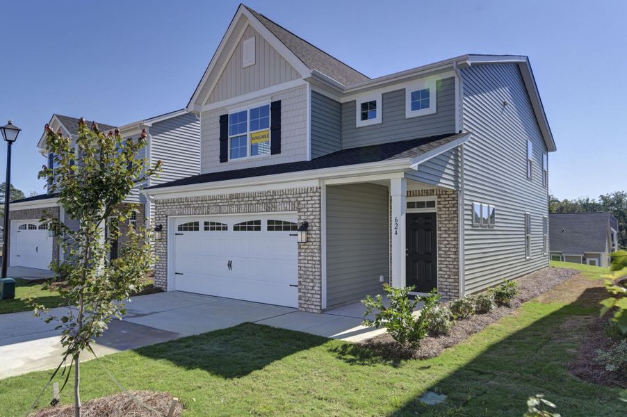Front exterior of a new home in Ashton Lakes, Lexington, SC, highlighting curb appeal (Image 2).
