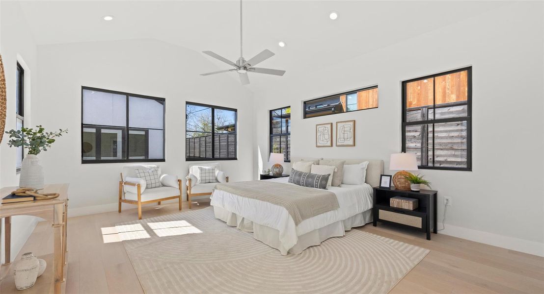 Bedroom with recessed lighting, light wood-style flooring, vaulted ceiling, and ceiling fan