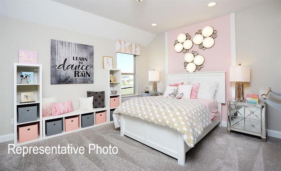 Recessed lighting illuminates a space featuring a prominent bed frame with a white headboard set against a pink accent wall Recessed lighting illuminates a space featuring a prominent bed frame with a white headboard set against a pink accent wall