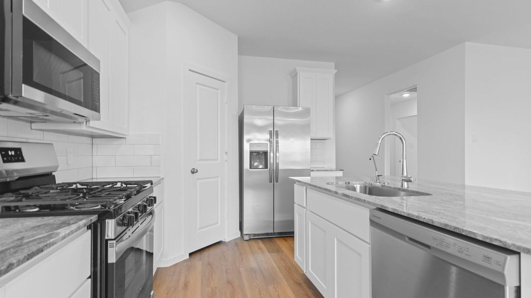 Furnished interior view inside a new home in Caldwell Crossing, Iowa Colony (Image 5).