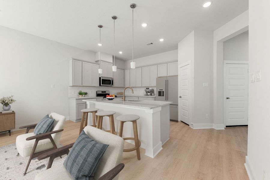 This modern kitchen showcases sleek cabinetry, stainless steel appliances, and a large island with bar seating. Clean lines and neutral tones create a bright, polished atmosphere, while pendant lighting adds a contemporary touch that enhances the overall design. This modern kitchen showcases sleek cabinetry, stainless steel appliances, and a large island with bar seating. Clean lines and neutral tones create a bright, polished atmosphere, while pendant lighting adds a contemporary touch that enhances the overall design.