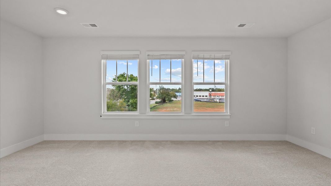 Spacious and serene primary suite with thoughtful design in a desirable DRB Homes community