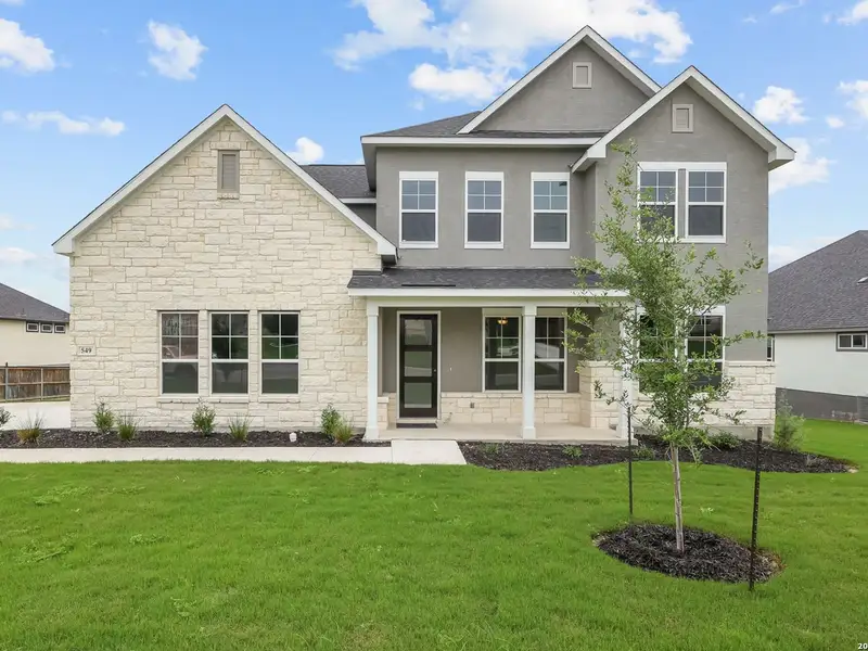 Front exterior of a new home in Potranco Oaks, Castroville, TX, highlighting curb appeal (Image 2). Front exterior of a new home in Potranco Oaks, Castroville, TX, highlighting curb appeal (Image 2).