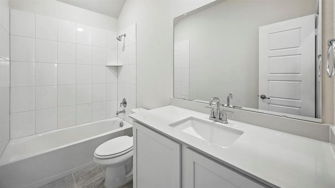 Full bathroom featuring vanity and washtub / shower combination