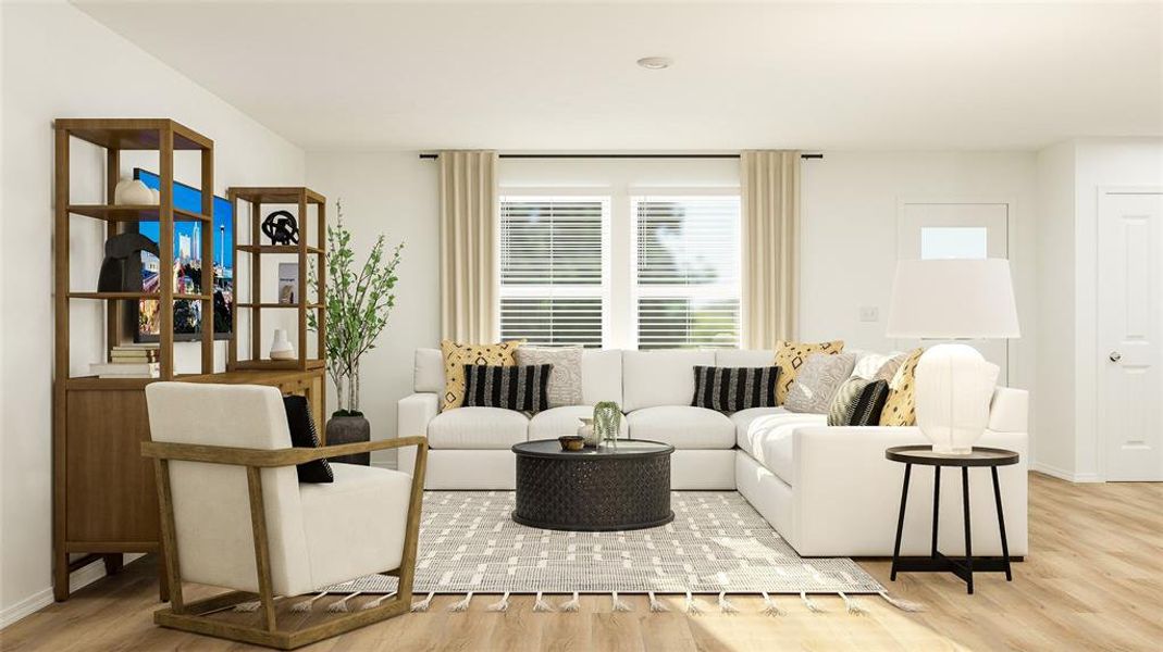 Living room featuring wood finished floors and baseboards Living room featuring wood finished floors and baseboards