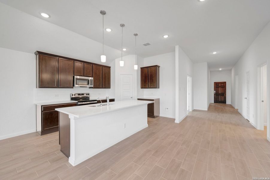 Furnished interior view inside a new home in Chaparral Ranch, Floresville (Image 11).