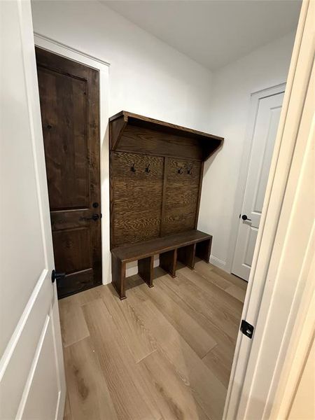 Mudroom with light wood-type flooring and baseboards Mudroom with light wood-type flooring and baseboards
