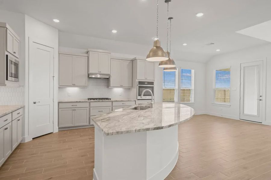 Representative furnished interior of a home built from the Mariah by Chesmar Homes in Lakes of Cane Island, Katy (Image 9).