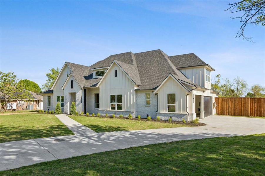 Front exterior of a new home in , Rowlett, TX, highlighting curb appeal (Image 1). Front exterior of a new home in , Rowlett, TX, highlighting curb appeal (Image 1).