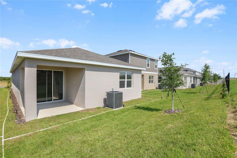 Front exterior of a new home in Seasons at Scenic Terrace, Lake Hamilton, FL, highlighting curb appeal (Image 15).