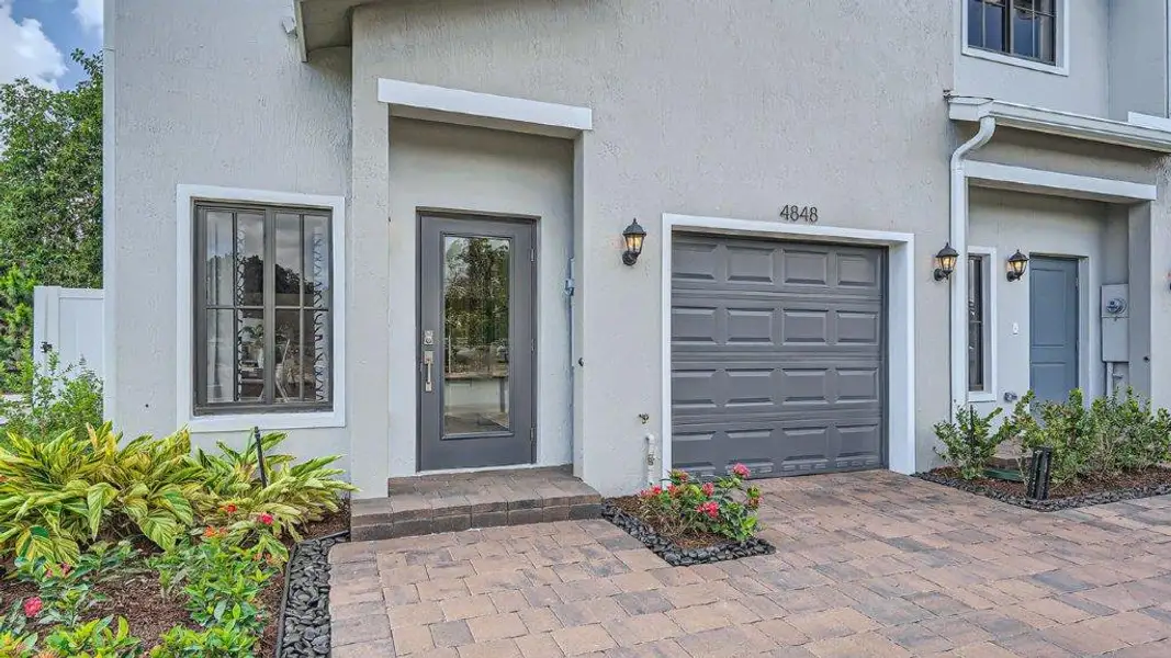 Exterior details and patio area of a home in Ashwood Cove, Lake Worth (Image 3).