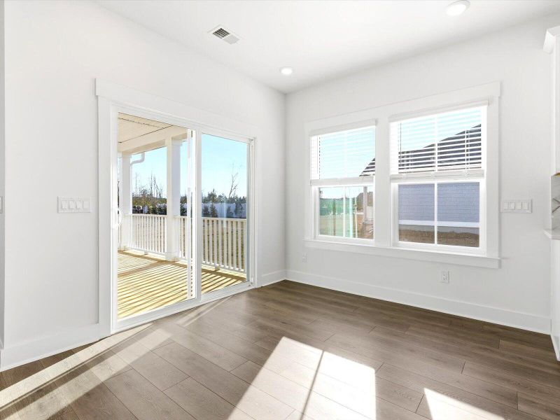 Spacious, unfurnished interior of a new home in The Coves at Lakes of Cane Bay, Summerville (Image 11).