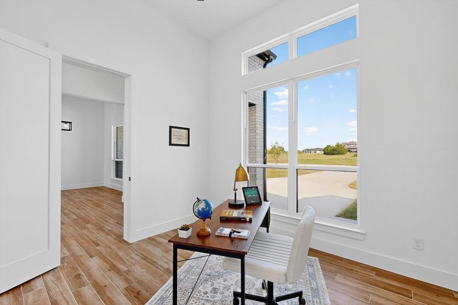 Home office featuring light wood-style floors