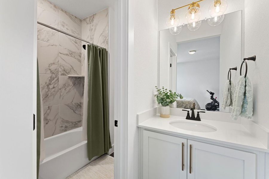 Full bath featuring shower / tub combo and vanity Full bath featuring shower / tub combo and vanity