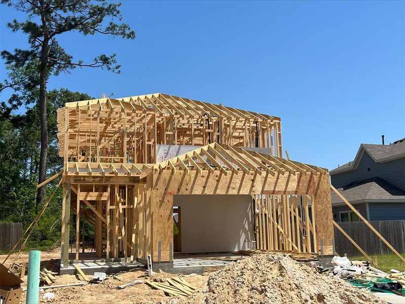 Front exterior of a new home in Maple Heights, Porter, TX, highlighting curb appeal (Image 2). Front exterior of a new home in Maple Heights, Porter, TX, highlighting curb appeal (Image 2).