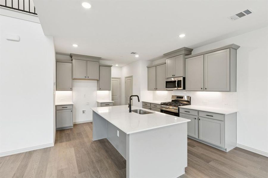 The spacious island is the hub of your new kitchen and the perfect place for friends and family to gather round!