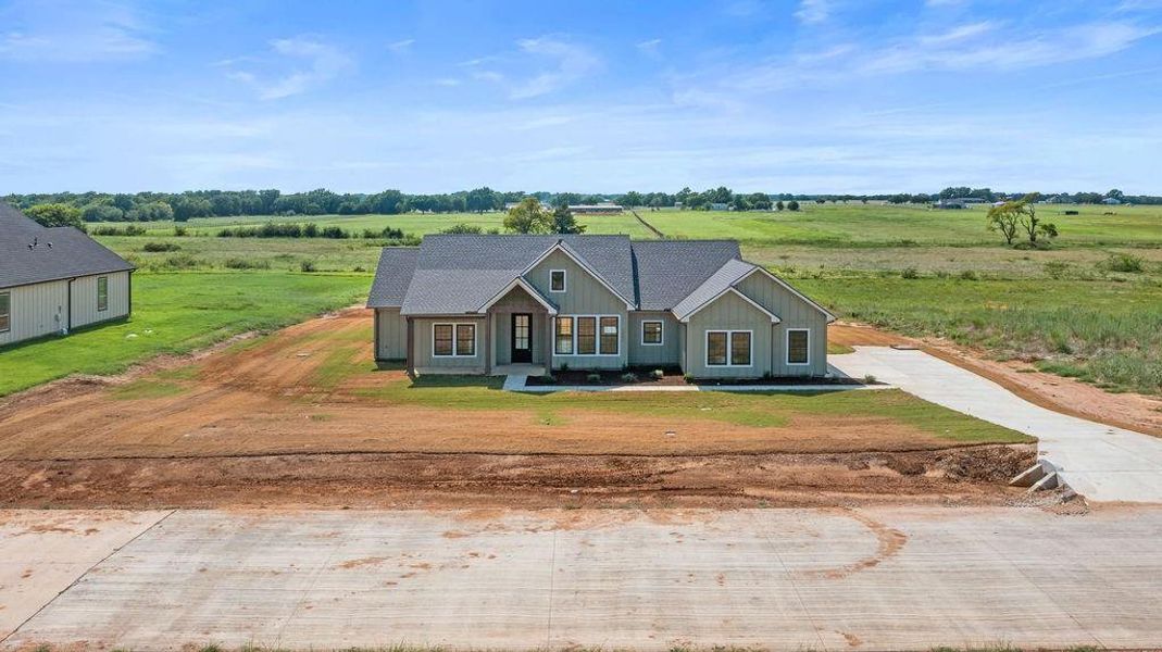 Front exterior of a new home in , Whitesboro, TX, highlighting curb appeal (Image 19).