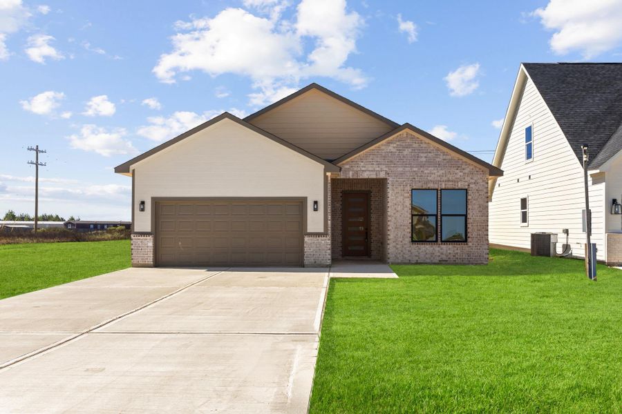 Front exterior of a new home in , Cleveland, TX, highlighting curb appeal (Image 2).