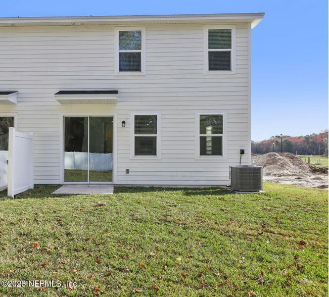 Exterior details and patio area of a home in Cypress Meadows - The Villas, Jacksonville (Image 3).