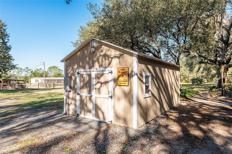 Exterior details and patio area of a home in , Weirsdale (Image 21).
