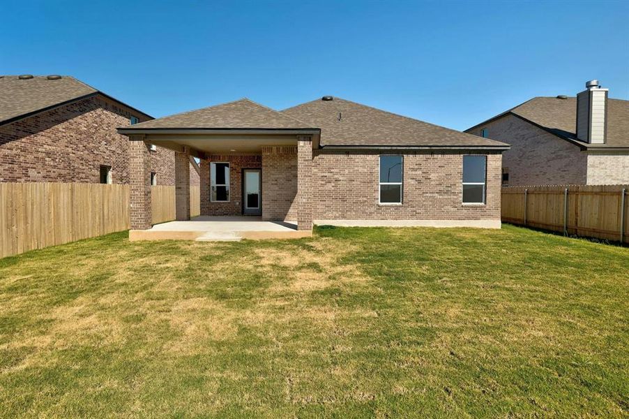 Relaxing back patio with ample space for outdoor dining and lounging, perfect for enjoying the views.