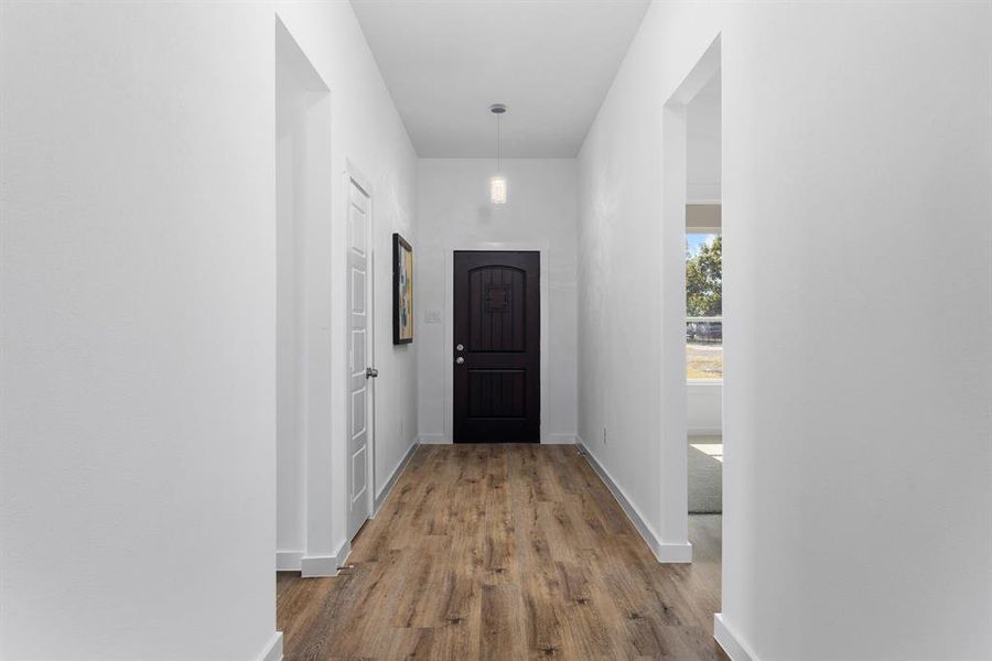 Corridor with wood-type flooring